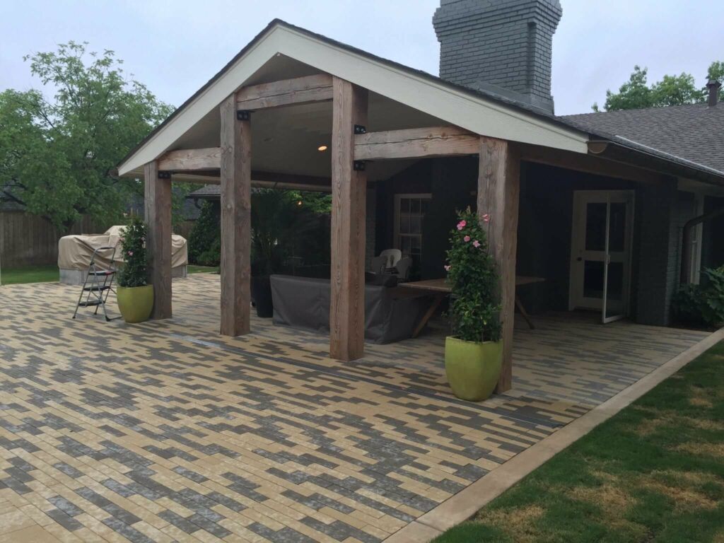 Cedar Posts, extended patio roof, custom pavers, copper gutters, speakers, and paint.
