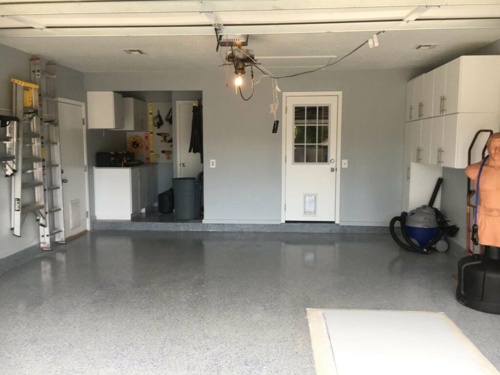 After - Refinished garage floor with epoxy multi-colored flakes.