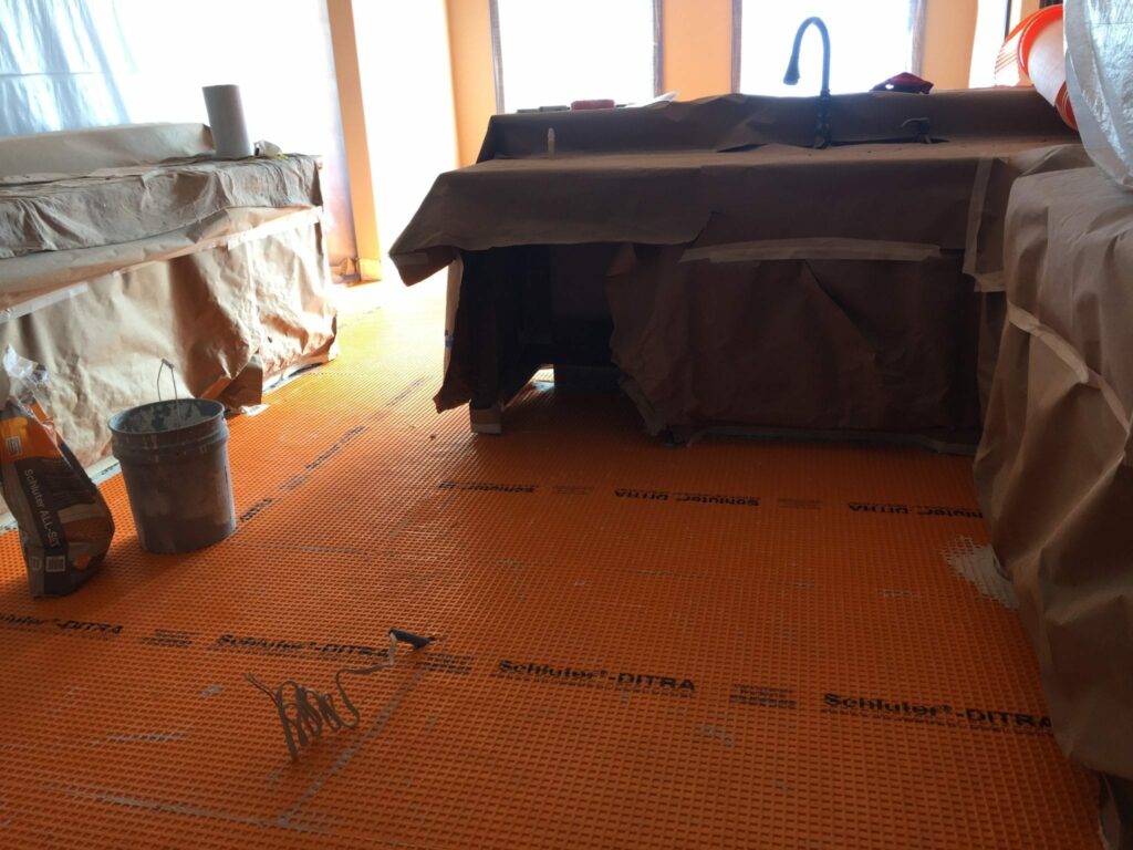 Kitchen tile replacement with Schluter-Ditra system.