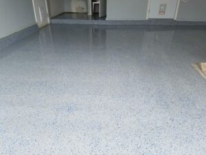After - Refinished garage floor with epoxy multi-colored flakes.