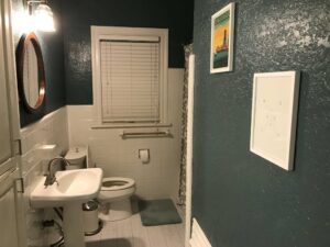 Bathroom remodeled with new floor tile, resurface wall tile, new paint, resurface tub, and new mirrors.