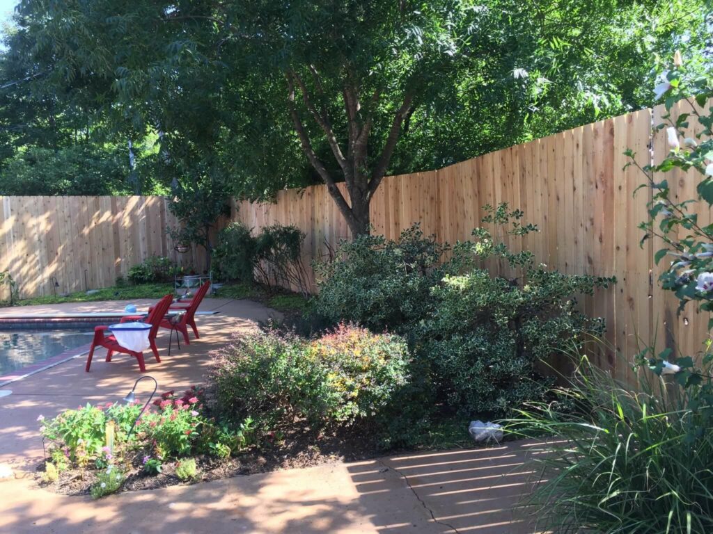 Installation of new 10-foot cedar fence. 