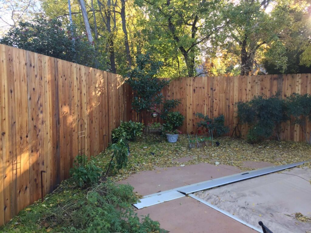 Installation of 10-foot high cedar fence and seal.