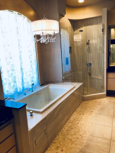 Beautiful - New shower and flowing floor tile, new shower glass, new stand-alone tub with new surrounding frame and tile, new chandelier.