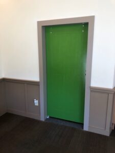 Installed and painted a barn door for a commercial business.