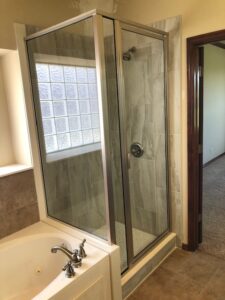 Complete shower remodel with new tile, framed shower glass and the Schluter system.