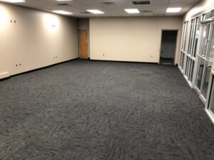 This commercial remodel includes new drywall, texture, paint, carpet, and ceiling grid.
