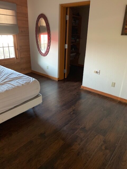 This room was remodeled with new engineered wood flooring.
