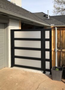 Custom metal gate with fogged inset pieces for privacy.
