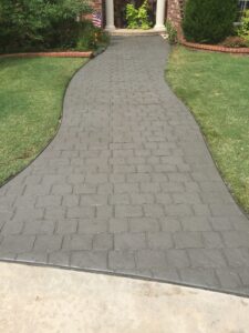 Custom stamped and colored concrete sidewalk.