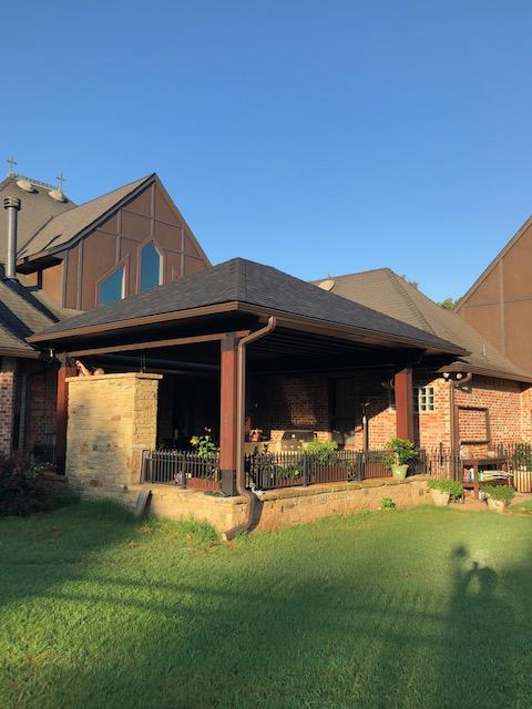 New outdoor patio cover with bead board ceiling and exposed cedar beams.