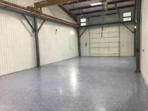 Custom commercial floor with epoxy coating and multi-colored flecks.
