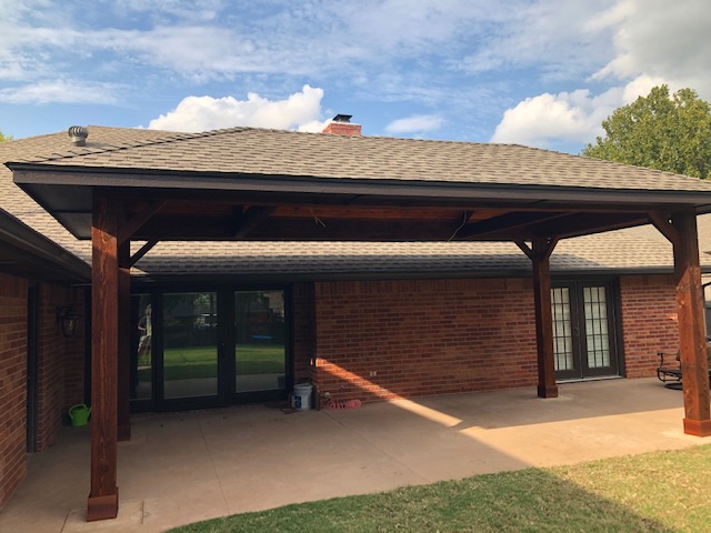 Cedar patio cover with beadboard ceiling, LED lights and outdoor fans.