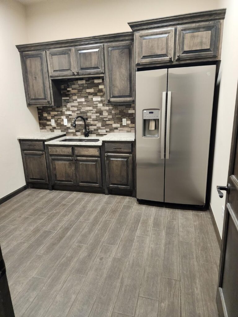 New commercial kitchen – new floor tile, cabinets, stain, countertops, backsplash.