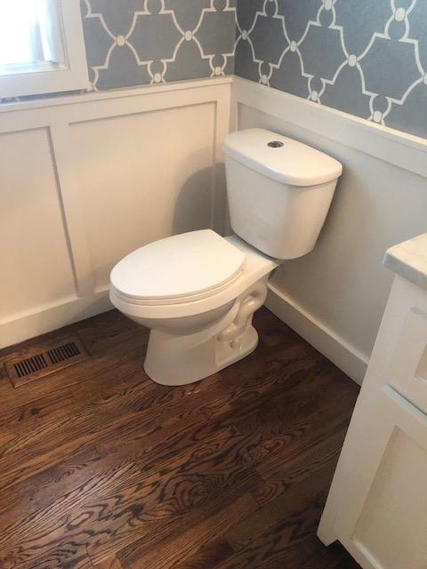 Pluming leak repair – installed new wood floor pieces, matched stain, replaced and painted wainscoting