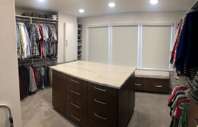 Converted small bedroom to new master closet. Beautiful island and 10 foot bench seat.