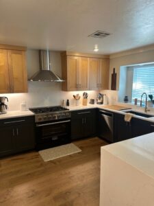 New granite countertops. New paint and hardware on lower cabinets. New range and hood vent. New wood floors