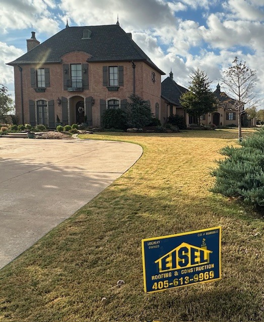 Elegant Deer Creek home with new luxury Grand Manor Class IV shingles, fresh paint, stain, cedar columns, and windows.